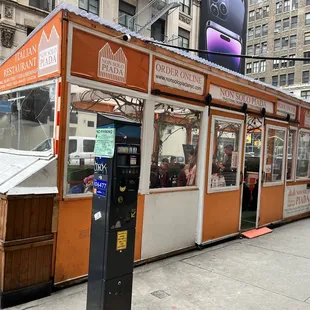 a vending kiosk on a city street