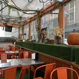 a restaurant with orange chairs