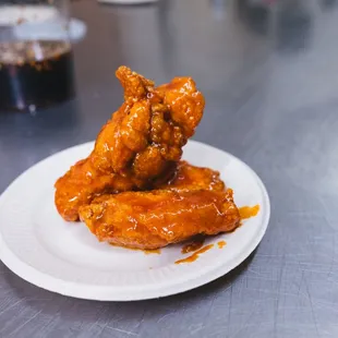 a plate of chicken wings on a table