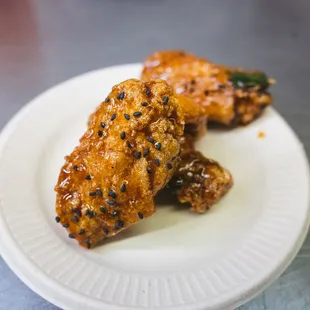 two pieces of chicken on a plate