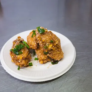 three pieces of fried chicken on a plate