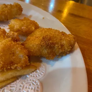 a plate of fried fish sticks