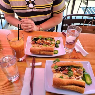 Pork banh mi sandwiches and a Thai iced tea.
