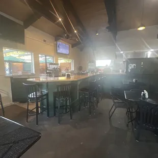Bar seating and some of the main dining area.