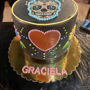 a cake with a sugar skull on it