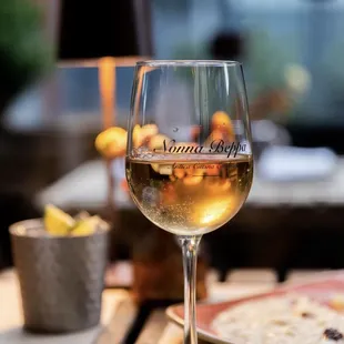 a glass of wine on a table