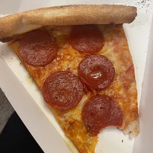 a slice of pepperoni pizza
