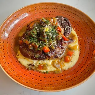 Braised veal osso bucco over four-cheese polenta