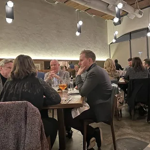 a group of people sitting at a table