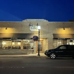 a car parked in front of a restaurant