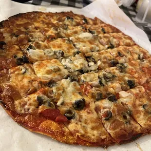 14" Thin Crust Pizza with pepperoni, black olives, &amp; onion