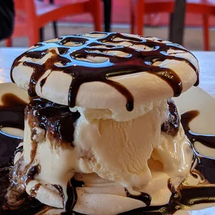 an ice cream sundae with chocolate sauce