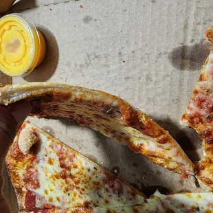 Very thin crust pizza. Note: it becomes tough and chewy when cold, so get it fresh and warm.