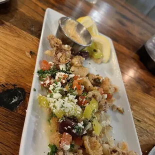 Calamari appetizer- great addition of the peppercinis and the capers to add zest and salt to the calamari.