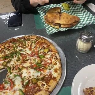 small pizza with pepperoni, peppers and jalapeno. Al Colpone sandwich.