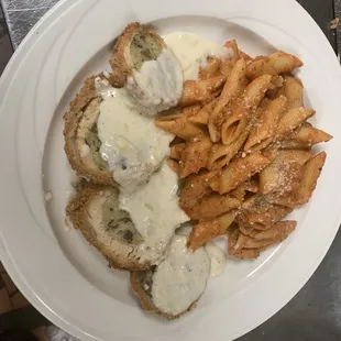 Stuffed Chicken (sausage, spinach, and cheese) lemon cream sauce and a side of penne a la Vodka.