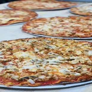 a variety of pizzas