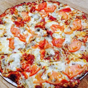 a pizza with tomatoes and cheese