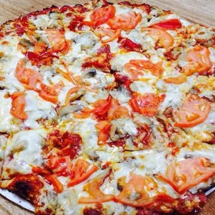 a pizza with tomatoes and cheese