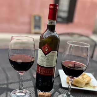 a bottle of wine and two glasses of wine