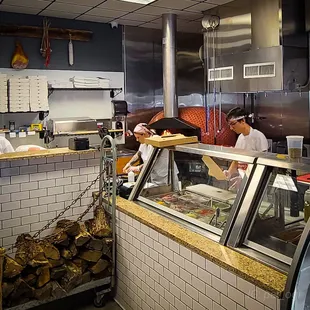 a group of people working in a restaurant