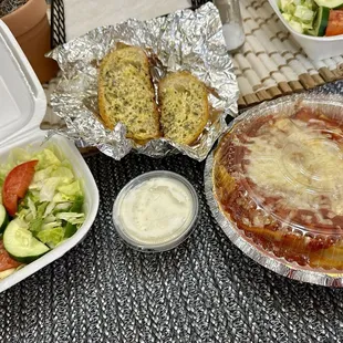 Lasagna with side salad and garlic bread