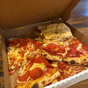 Large pepperoni pizza with breadsticks. They came in separate boxes but I put them together