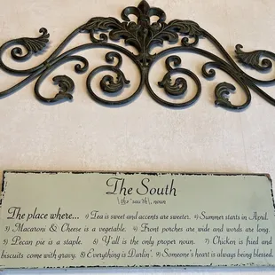 Cute sign  on the wall near the front entrance.