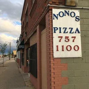 a sign on the side of a building