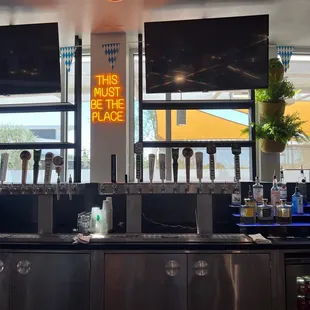 a bar with a sign that says this must be the place