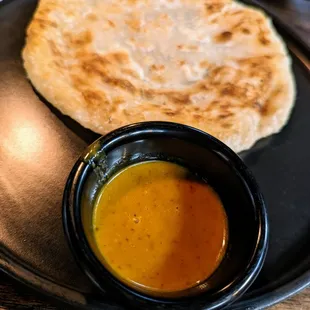 Rotee &amp; Curry. $6. Indian pancake served with yellow curry and cucumber salad sauce.