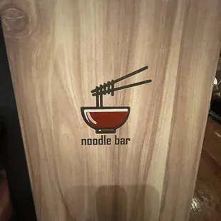 chopsticks and noodles in a bowl
