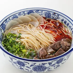a bowl of noodles and meat