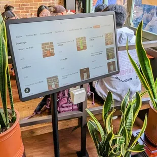 Order takeout, and pay, using the touch screen kiosk at the door.