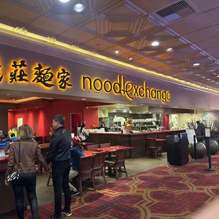 people standing in line at the counter