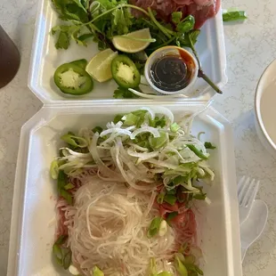 With tax. $22. Large beef pho two spring rolls two fried rolls. Sauce is perfect. Tons of meat. Tons of sprouts and herbs. Amazing.