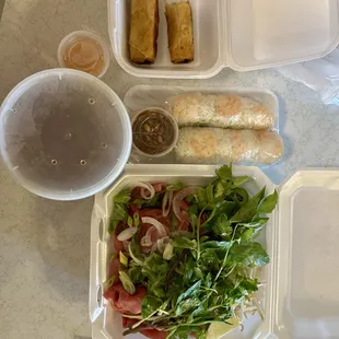 With tax. $22. Large beef pho two spring rolls two fried rolls. Sauce is perfect. Tons of meat. Tons of sprouts and herbs. Amazing.