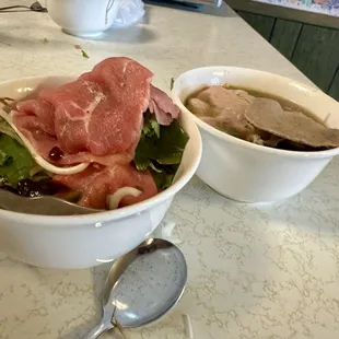 With tax. $22. Large beef pho two spring rolls two fried rolls. Sauce is perfect. Tons of meat. Tons of sprouts and herbs. Amazing.