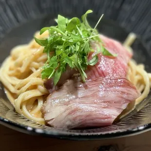 a piece of meat and noodles