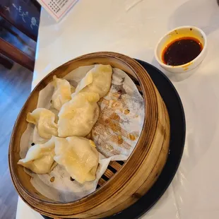 Steamed pork dumplings with chili sauce