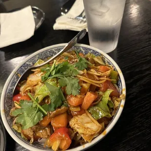 a plate of noodles and vegetables