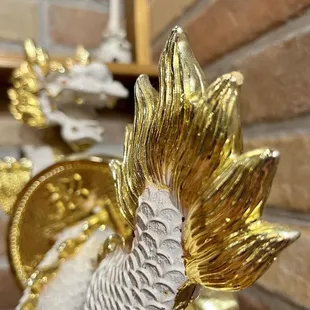 a gold and white dragon statue