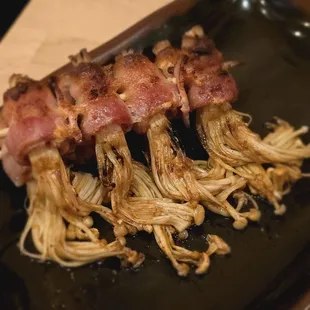 Bacon wrapped needle mushrooms