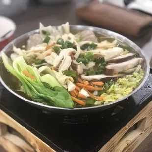 a bowl of noodles and vegetables