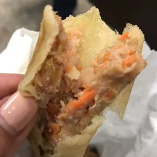 Not fully cooked on the inside. Lumpia never tastes sour.