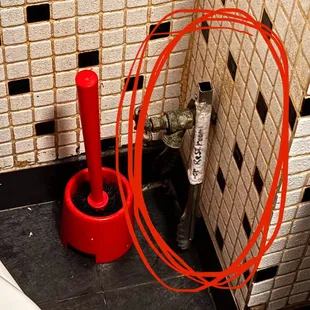 Bathroom tongs?!  lol!!! If it won't go down.... Pull it out!