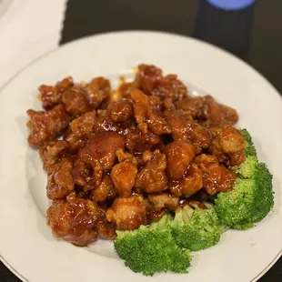 Orange chicken, seared alongside a big plate of white rice.