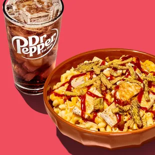 a drink and a bowl of macaroni and cheese