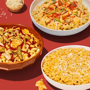 three bowls of pasta and a bowl of chicken