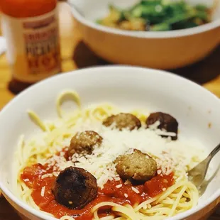 a bowl of spaghetti and meatballs